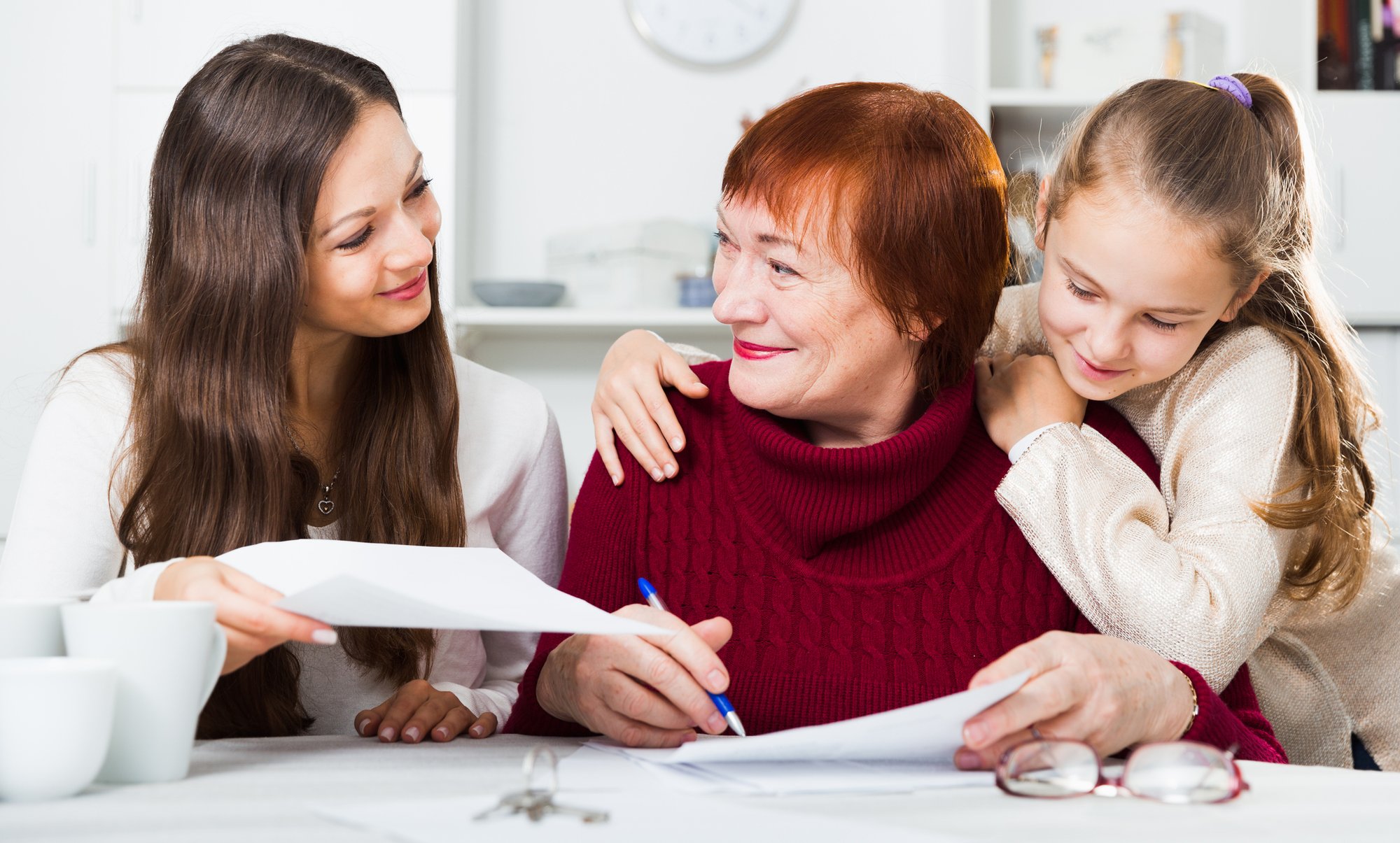 Happy-family-working-with-documents-at-home-952372128_2234x1346