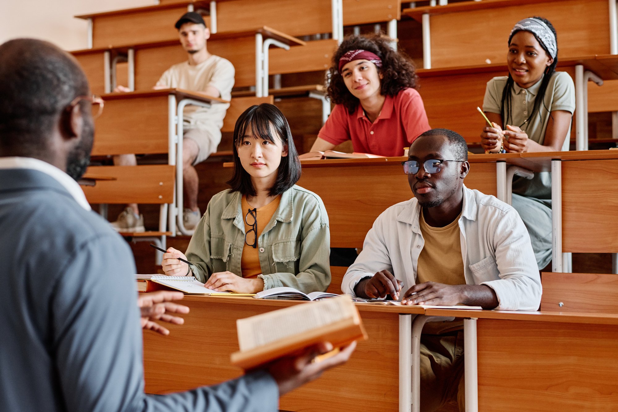 Students-listening-to-teacher-at-lecture-1414024665_2125x1416