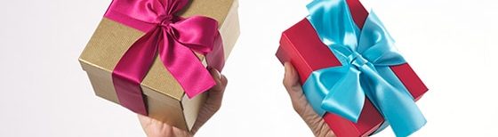 presents with pink and blue ribbons