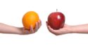 holding orange and apple