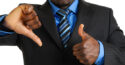 man in suit giving thumbs up and thumbs down