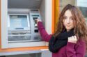 woman withdrawing money from ATM